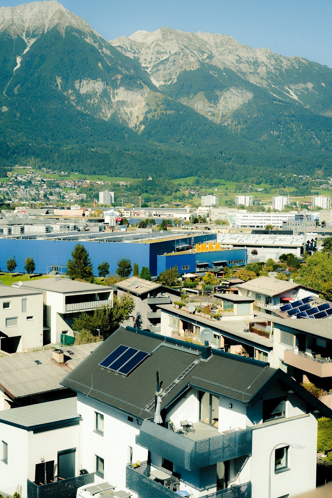Home a-town-nestled-at-the-base-of-a-large-mountain-joafyex0q3e